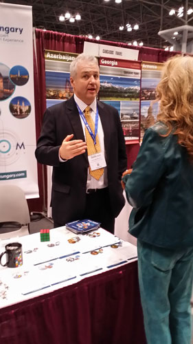 Richard Bogdan speaking with an attendee at the NY Travel Show